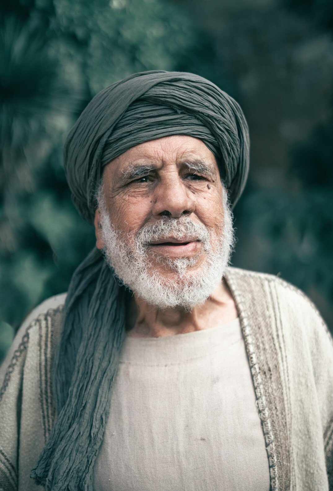 Turkish man senior mediator professional headshot
